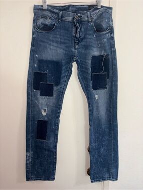 Armani Exchange denim jeans feature a distinct patchwork Distressed Size 33 Slim